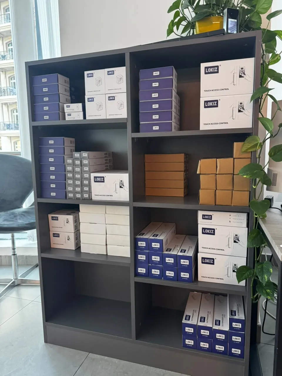 Shelf of LOKIZ touch access control keypads, EM locks and emergency break glass units in Dubai